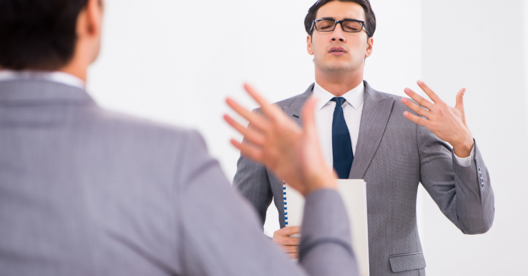 speaking in front of mirror